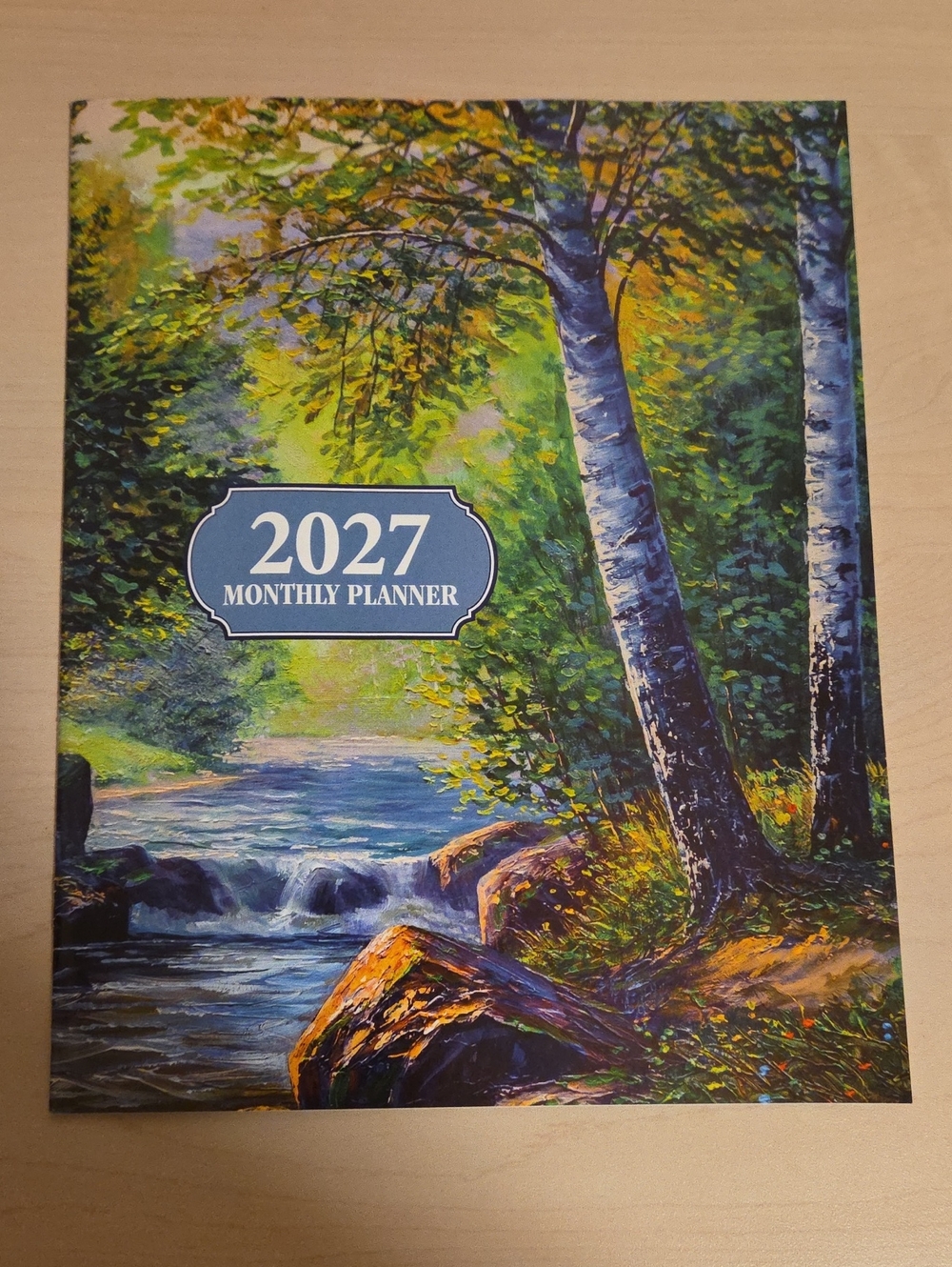 2027 Monthly Planner - Riverside Wilderness Scene
